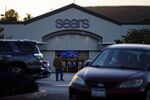 Shoppers walk outside of a Sears Holdings Corp. store in Montebello, California.