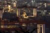 Gantry cranes operate as containers sit at the Yangshan Deepwater Port, operated by Shanghai International Port Group Co. (SIPG), in the early morning in Shanghai, China, on Wednesday, Aug. 7, 2019. Trump's threat to raise tariffs on all Chinese goods last week shattered a truce reached with Xi just weeks earlier, unleashing tit-for-tat actions on trade and currency policy that risk accelerating a wider geopolitical fight between the world's biggest economies.
