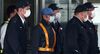 TOPSHOT - Former Nissan chairman Carlos Ghosn (C-light blue cap) is escorted as he walks out of the Tokyo Detention House following his release on bail in Tokyo on March 6, 2019. - Ghosn posted bail of 1 billion yen (9 million USD) in cash on March 6, paving the way for his release from the Tokyo detention centre after more than three months in custody. (Photo by Behrouz MEHRI / AFP) (Photo by BEHROUZ MEHRI/AFP via Getty Images)