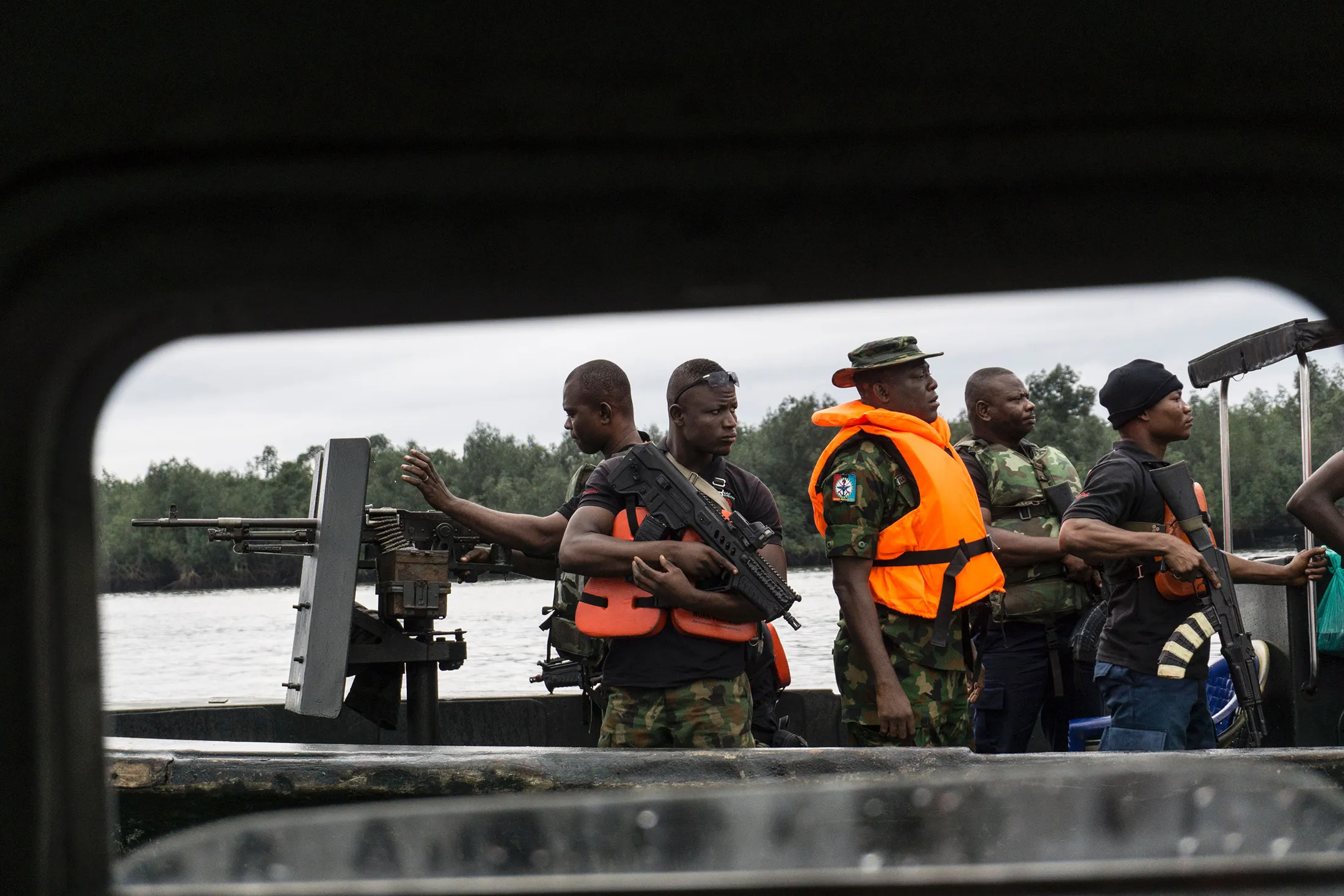 Members of the Nigerian Navy patrol the Niger Delta in 2017.&nbsp;