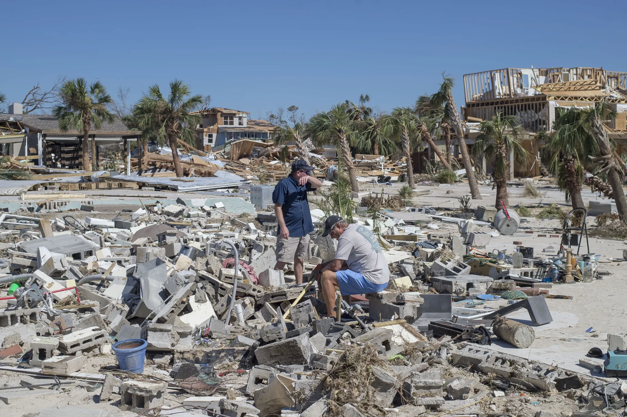 Residents survey debris after Hurricane Michael hit in Mexico Beach, Florida, on Oct. 12, 2018.