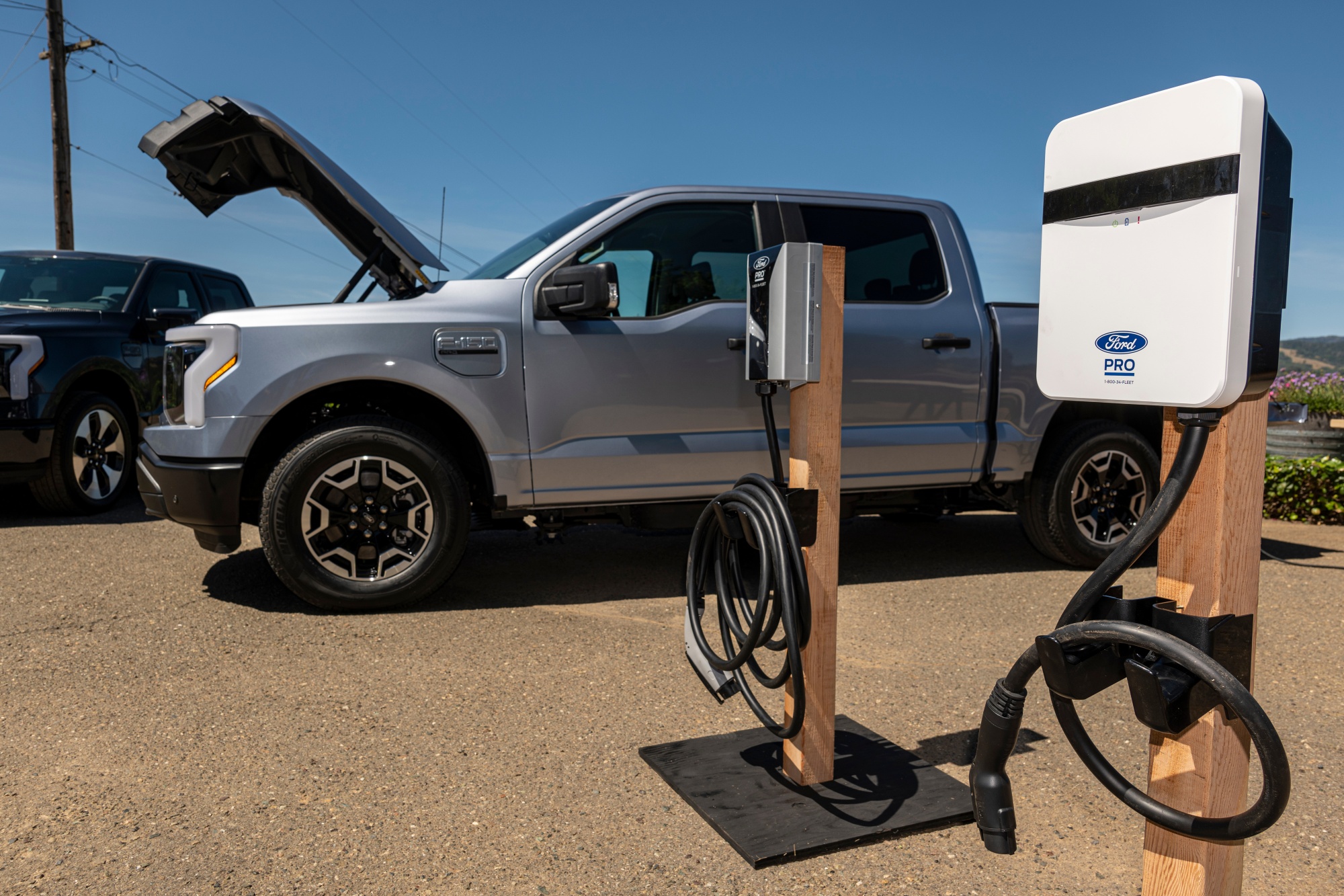 An F-150 Lightning pickup next to Ford Pro&nbsp;chargers during a media event last month in Healdsburg, California.