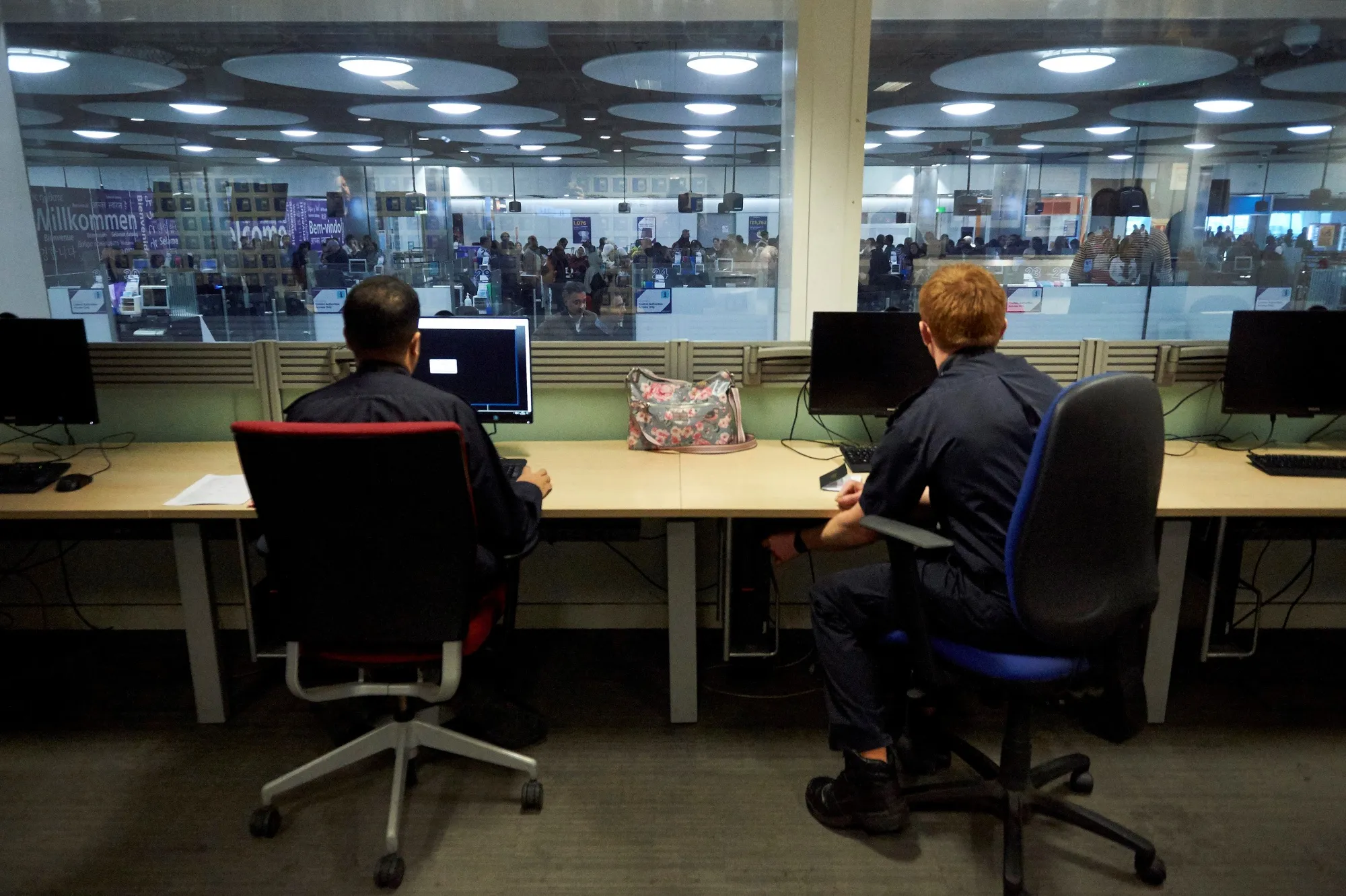 Border Force officers work in the watch room&nbsp;at Terminal 5 at London Heathrow Airport.