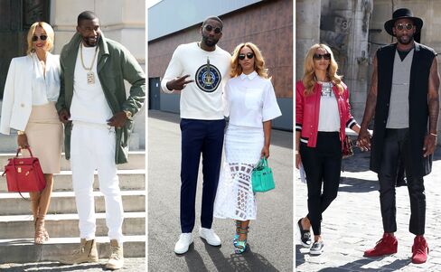 From left: The Stoudemires outside the Balmain, Kenzo, and Lanvin Menswear Spring/Summer 2016 shows in Paris.