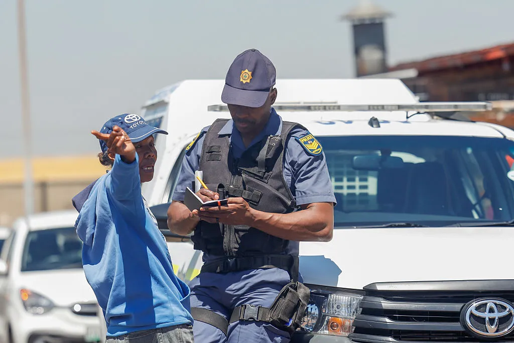 Police take statements during gang&nbsp;violence incidents&nbsp;in Johannesburg, South Africa.