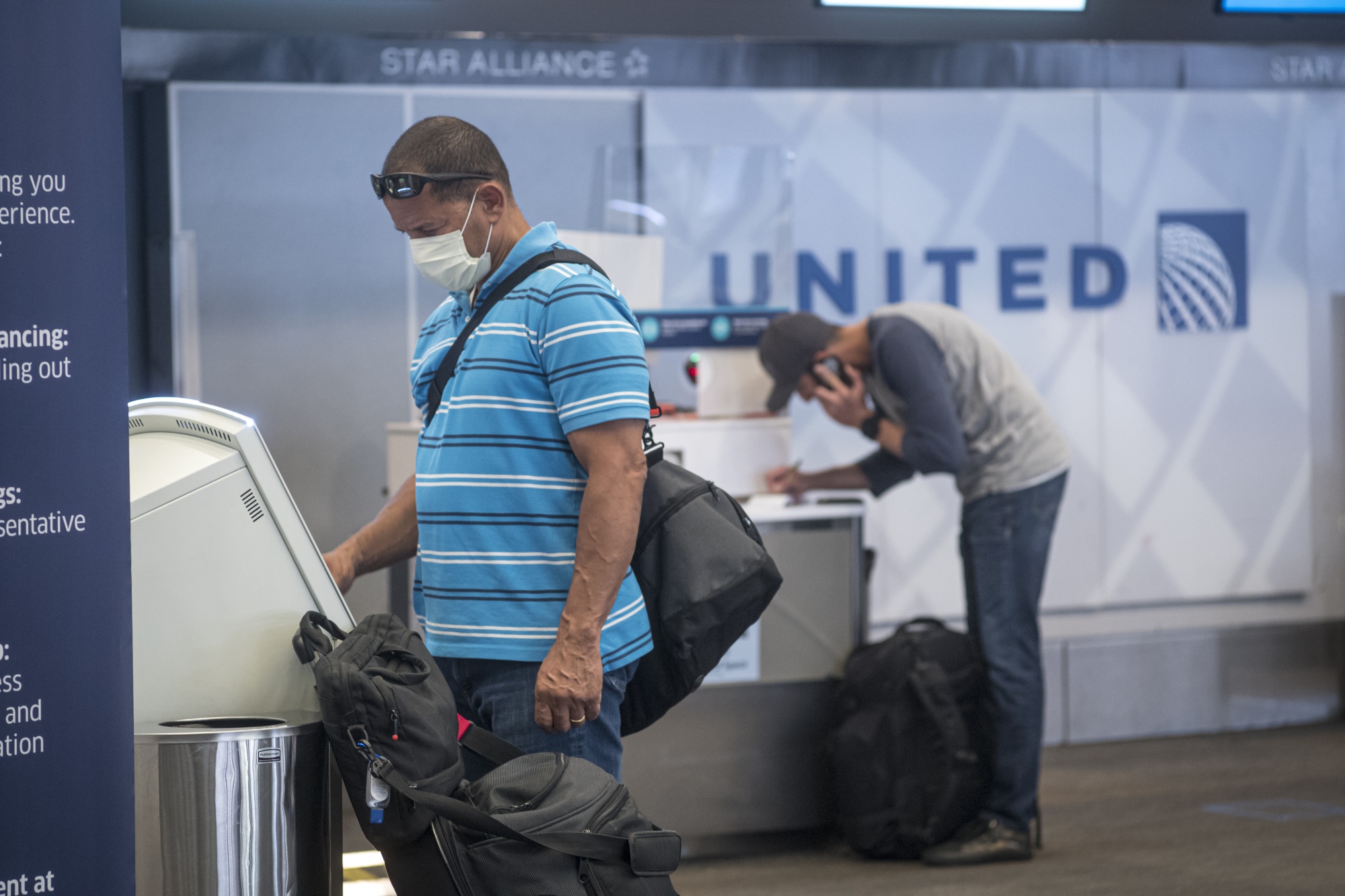 A traveler&nbsp;uses a kiosk to check-in at a United counter at San Francisco International Airport&nbsp;on&nbsp;July 1.