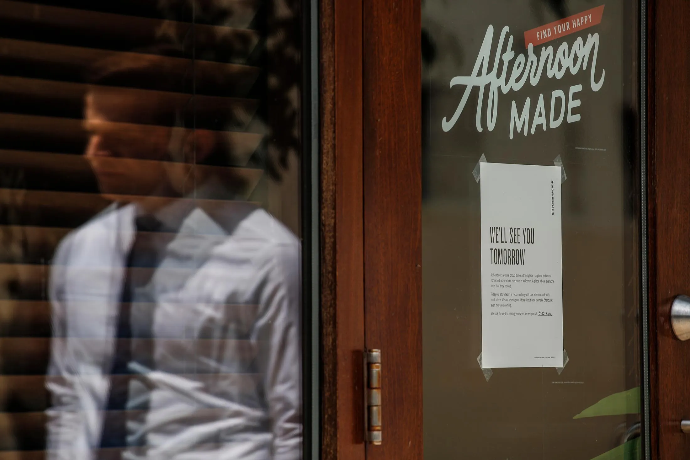 A 'store closed' note is displayed at the Spruce St. Starbucks store on May 29, 2018 in Philadelphia, Pennsylvania.&nbsp;Starbucks closed about 8,000 stores across the United States Tuesday to conduct employee training on racial bias, a closely watched exercise that spotlights lingering problems of discrimination nationwide. Starbucks announced its own training on April 17 as it battled to contain outrage over the arrest of two young black men at the Philadelphia store.