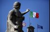 The national flag of Italy, center, and the European Union (EU) flag, right, fly from the Quirinale palace, the office of Italy's president, in Rome, Italy.