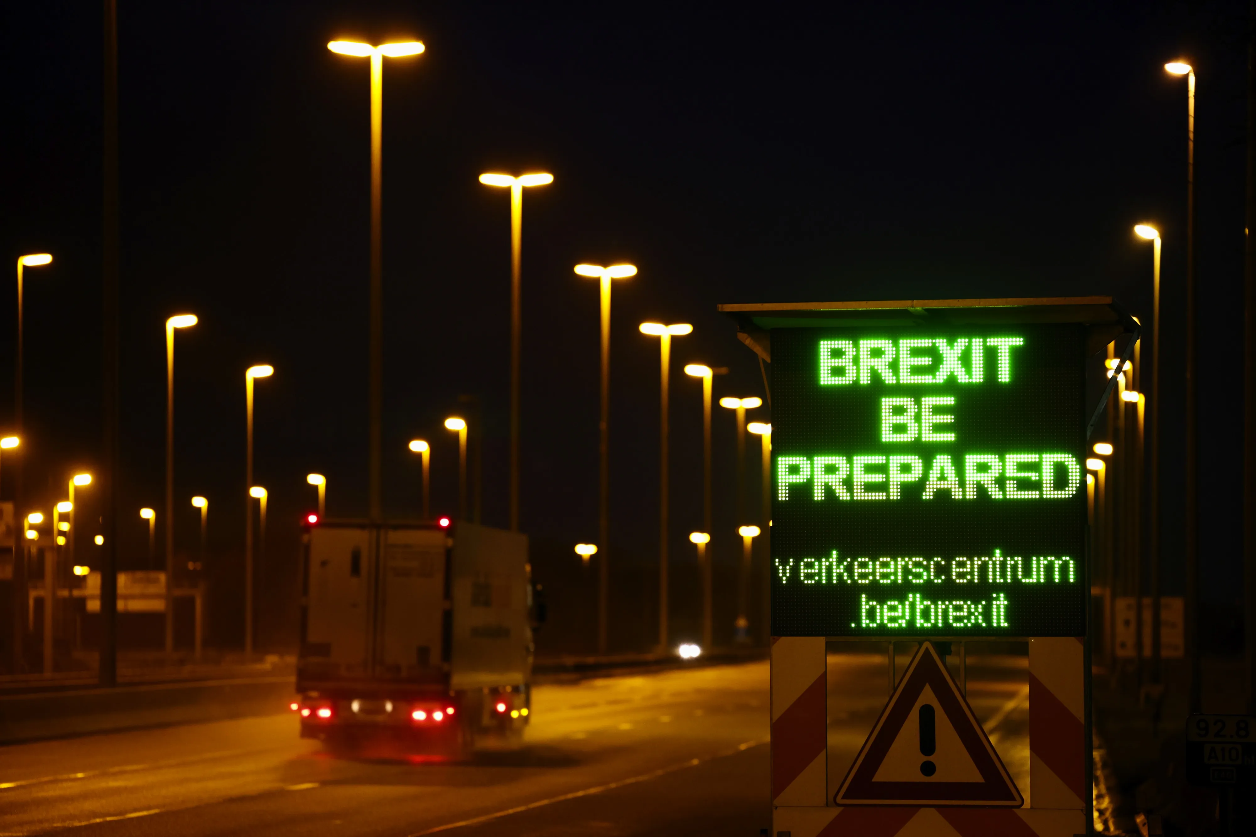 A 'Brexit Be Prepared' warning sign on the E40 highway towards Calais.