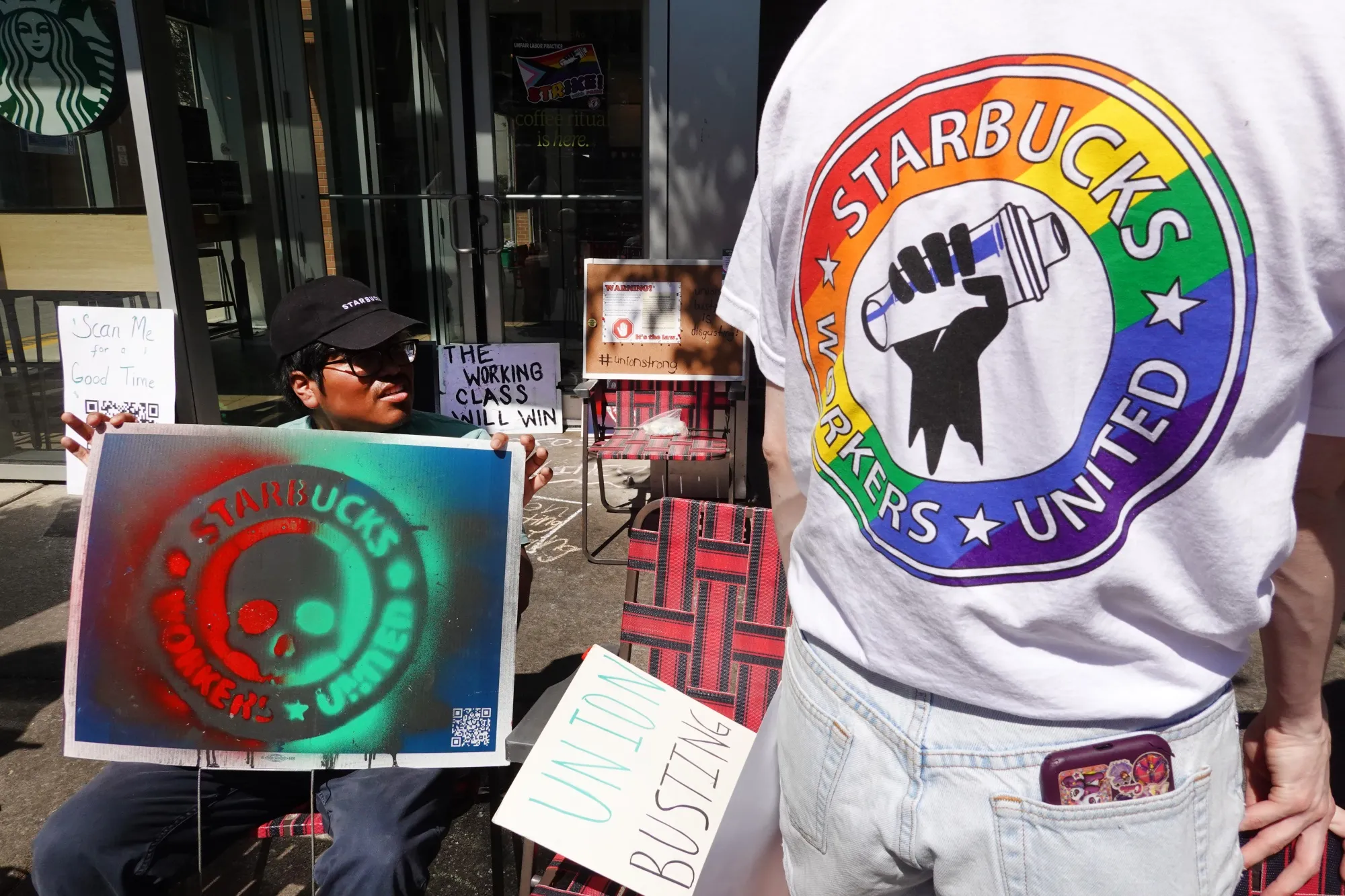 People picket in front of a Starbucks store in Chicago, on June 24. 