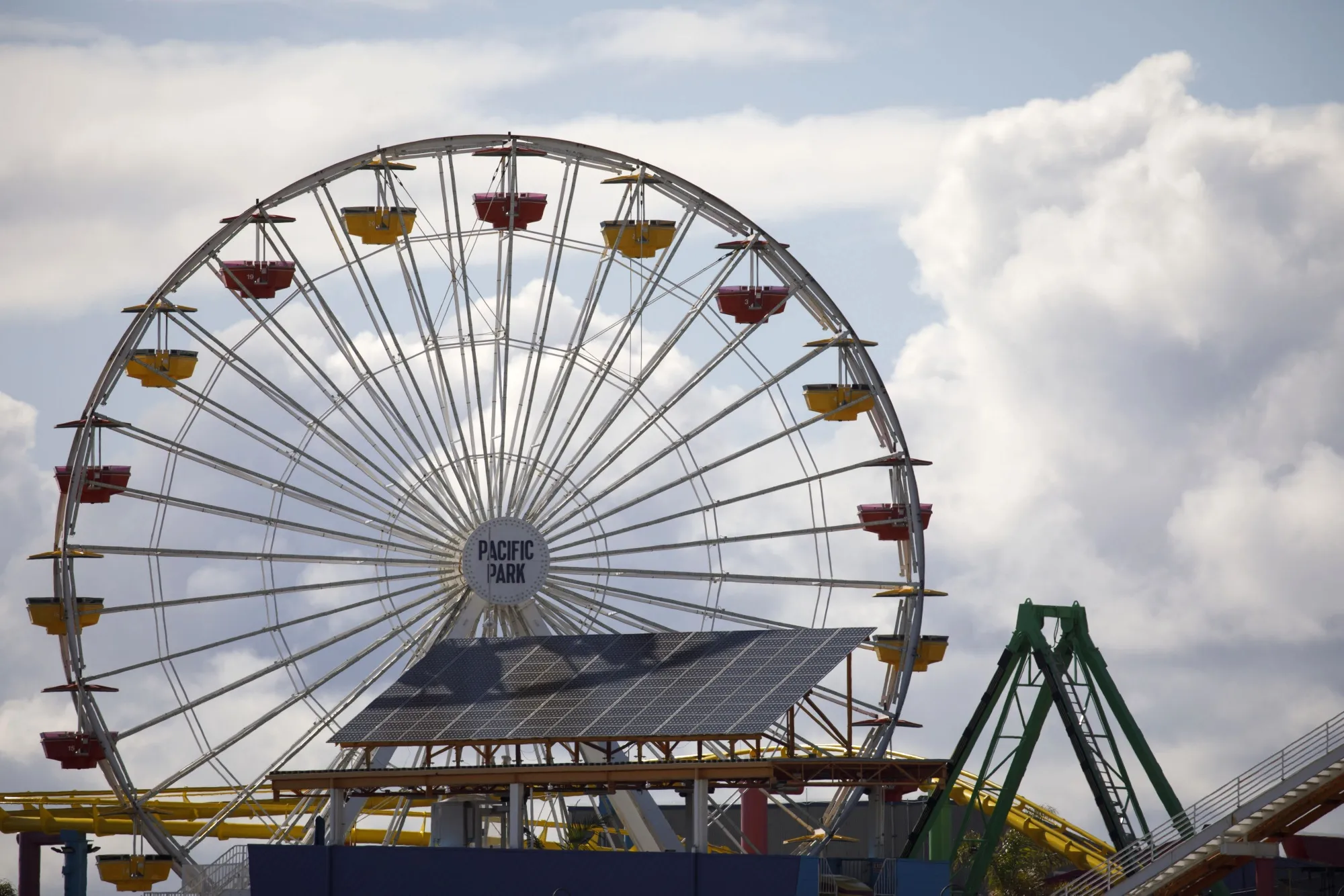 An empty Ferris wheel at Pacific Park stands at the Santa Monica Pier.