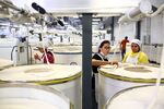 Ni Meijuan, center, with trainees Enabel Perez, right, and Maria Elisena de Leon, left, at Keer Group’s cotton mill in Lancaster County, South Carolina, on May 20, 2015.