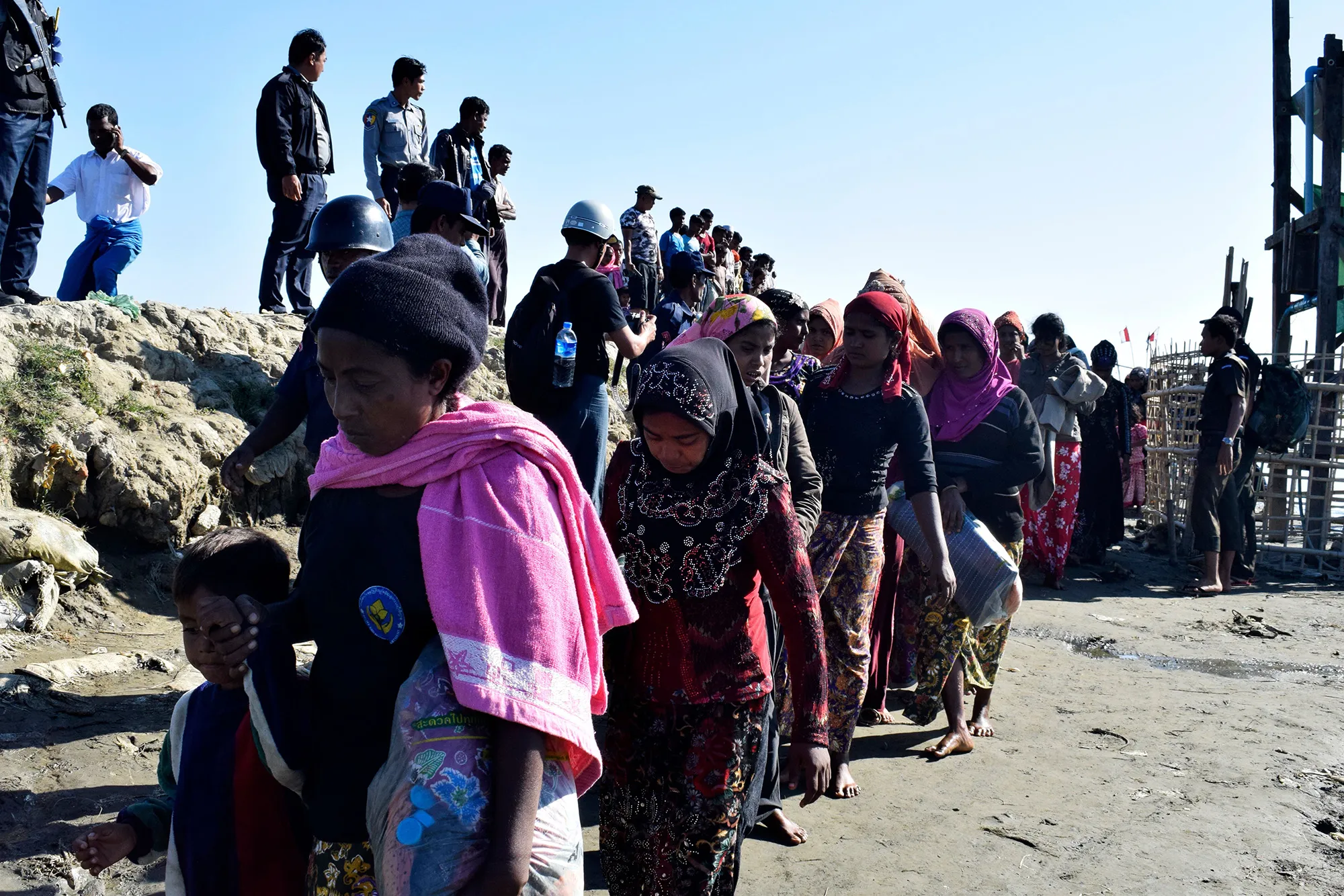 Myanmar Navy personnel escort Rohingya Muslims back to their camp in Sittwe, Rakhine state, on Nov.&nbsp;30, 2018