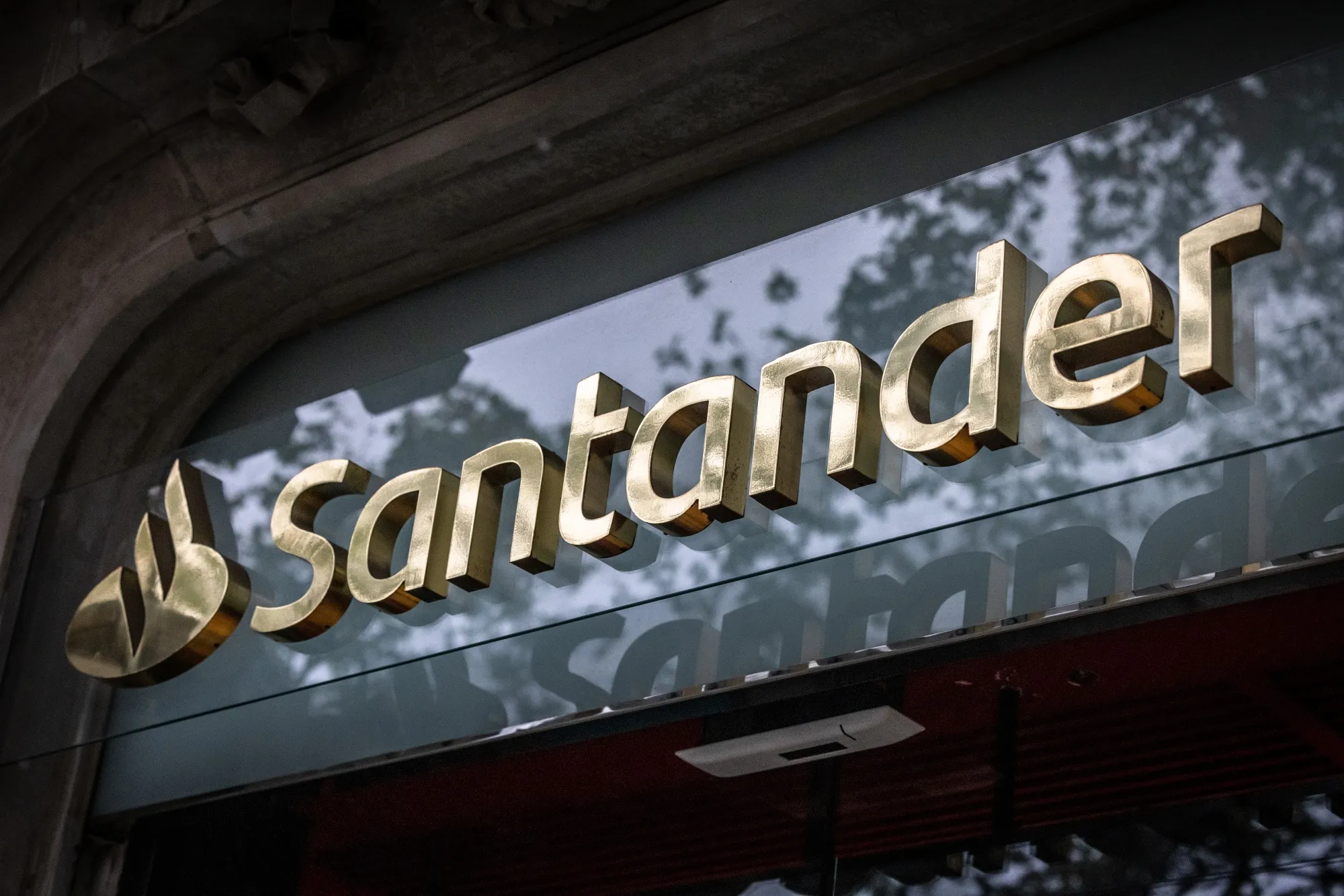 A logo outside a Banco Santander SA bank branch in Barcelona, Spain, on Saturday, Oct. 26, 2024. Santander is expected to report results on Oct. 29.