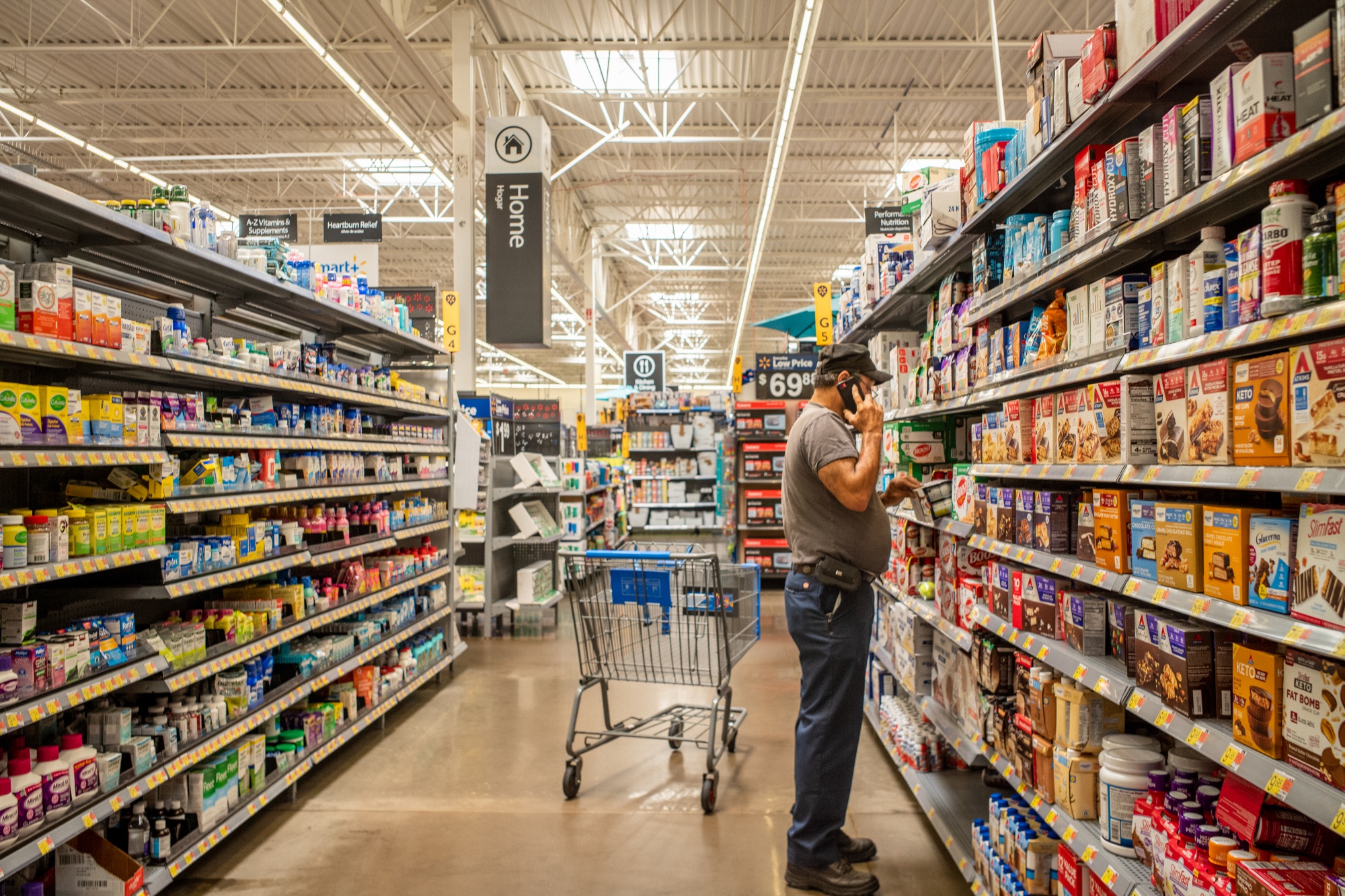 A Grocery Store Aisle at a Walmart Store with No People Editorial