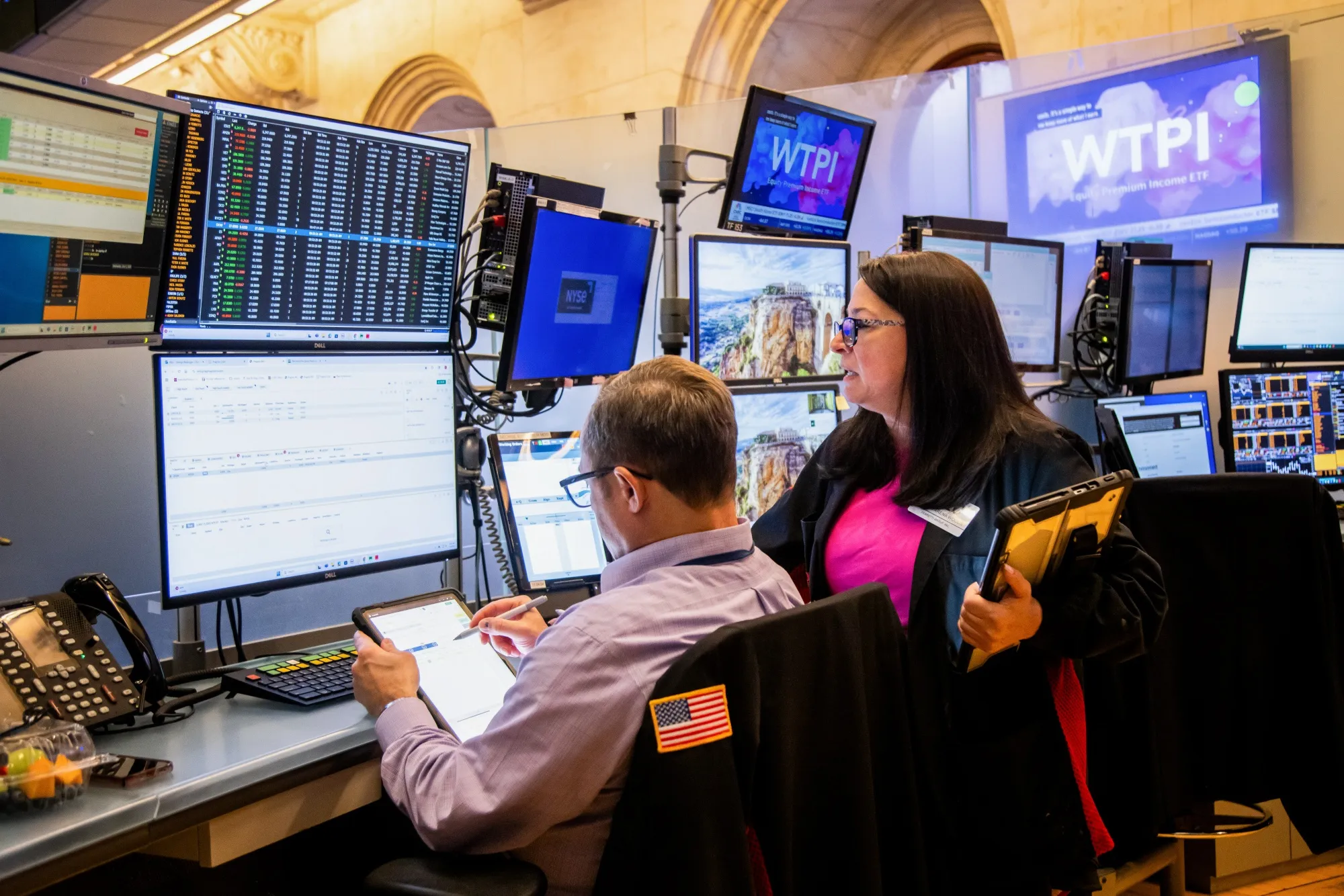 Traders work on the floor at the New York Stock Exchange.