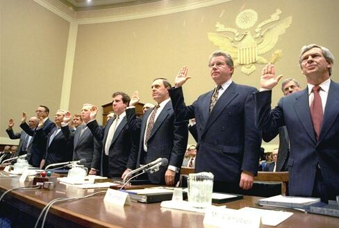 Heads of the nation's largest cigarette companies are sworn in before a House Energy subcommittee hearing on Capitol Hill on April 14, 1994.
