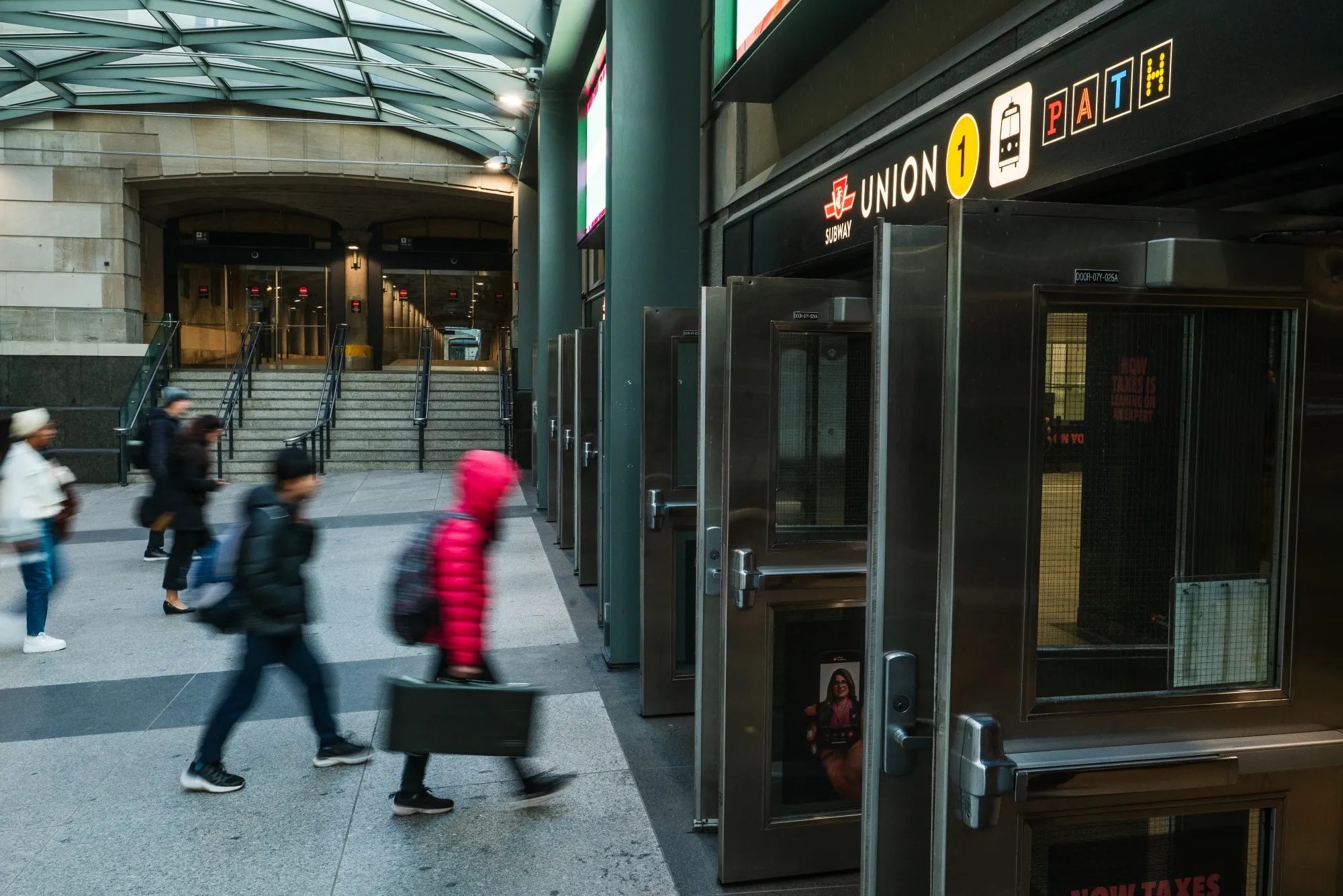 Commuters enter Union Station in the financial district of Toronto.