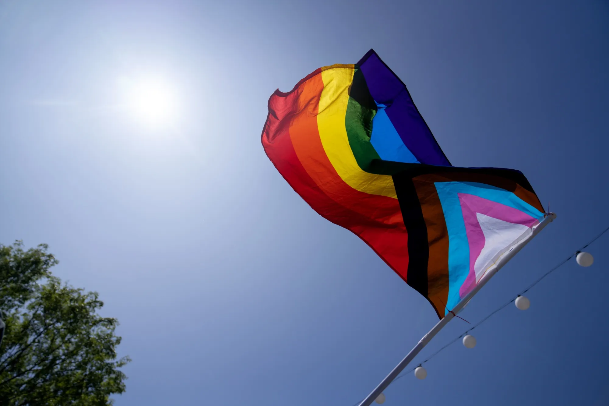 A progress pride flag during the Drag March LA protest in response to the increasing number of anti-LGBTQ+ bills being introduced or passed in the US.