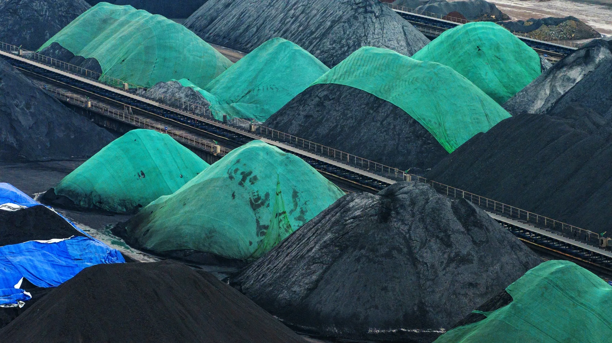 Coal stockpiles at the Guoyuan Port Container Terminal in Chongqing, China. The nation mines and burns half of the world’s supply.&nbsp;