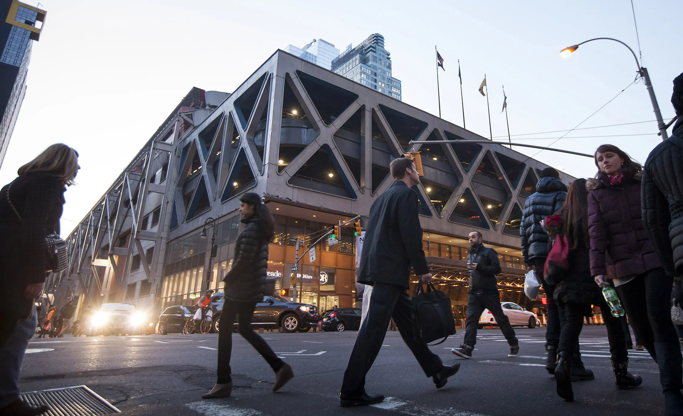 Pedestrians pass the Port Authority Bus Terminal in New York.
