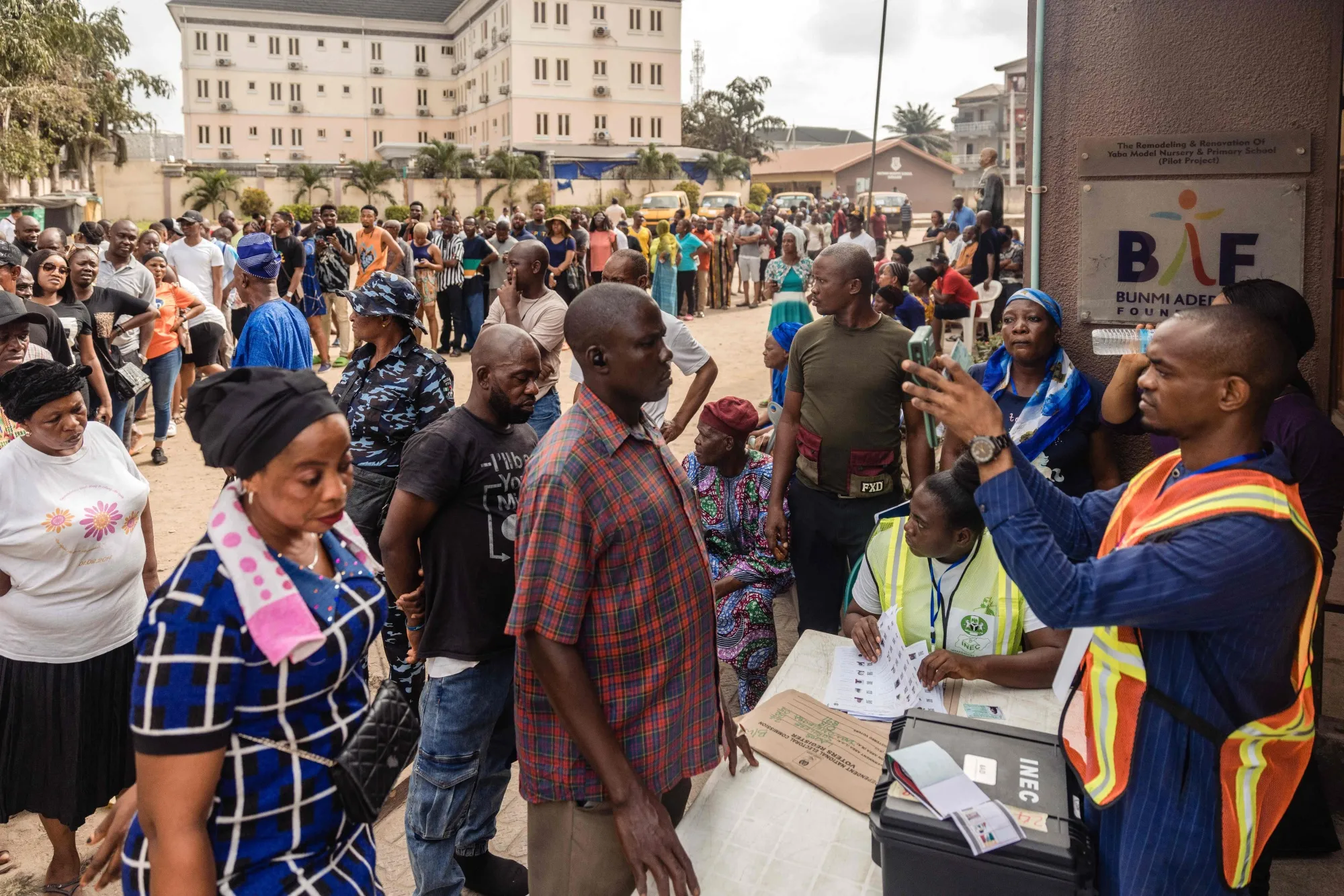 An electoral official uses a Bimodal Voter Accreditation System at a polling station in Ojuelegba, Lagos, Feb 25.