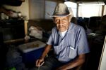 Samuel Cole, 85, of Los Angeles, poses in his motorhome. Cole moved into the vehicle when he wasn't able to afford a $100 rise in his rent.