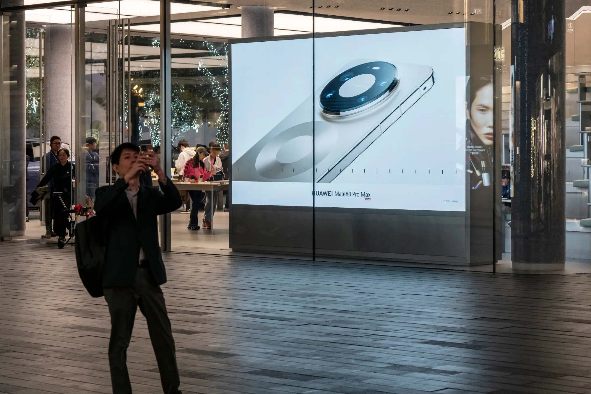 An advertisement for the Huawei Technologies Co. Mate 80 Pro Max smartphone displayed at one of the company's stores in Shenzhen, China.