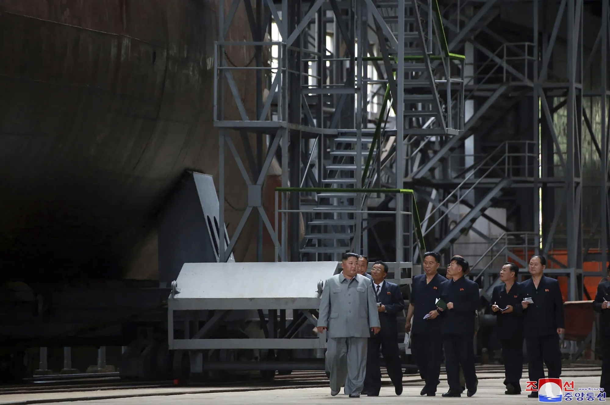 This handout by the North Korean state media shows Kim Jong Un inspects a submarine.