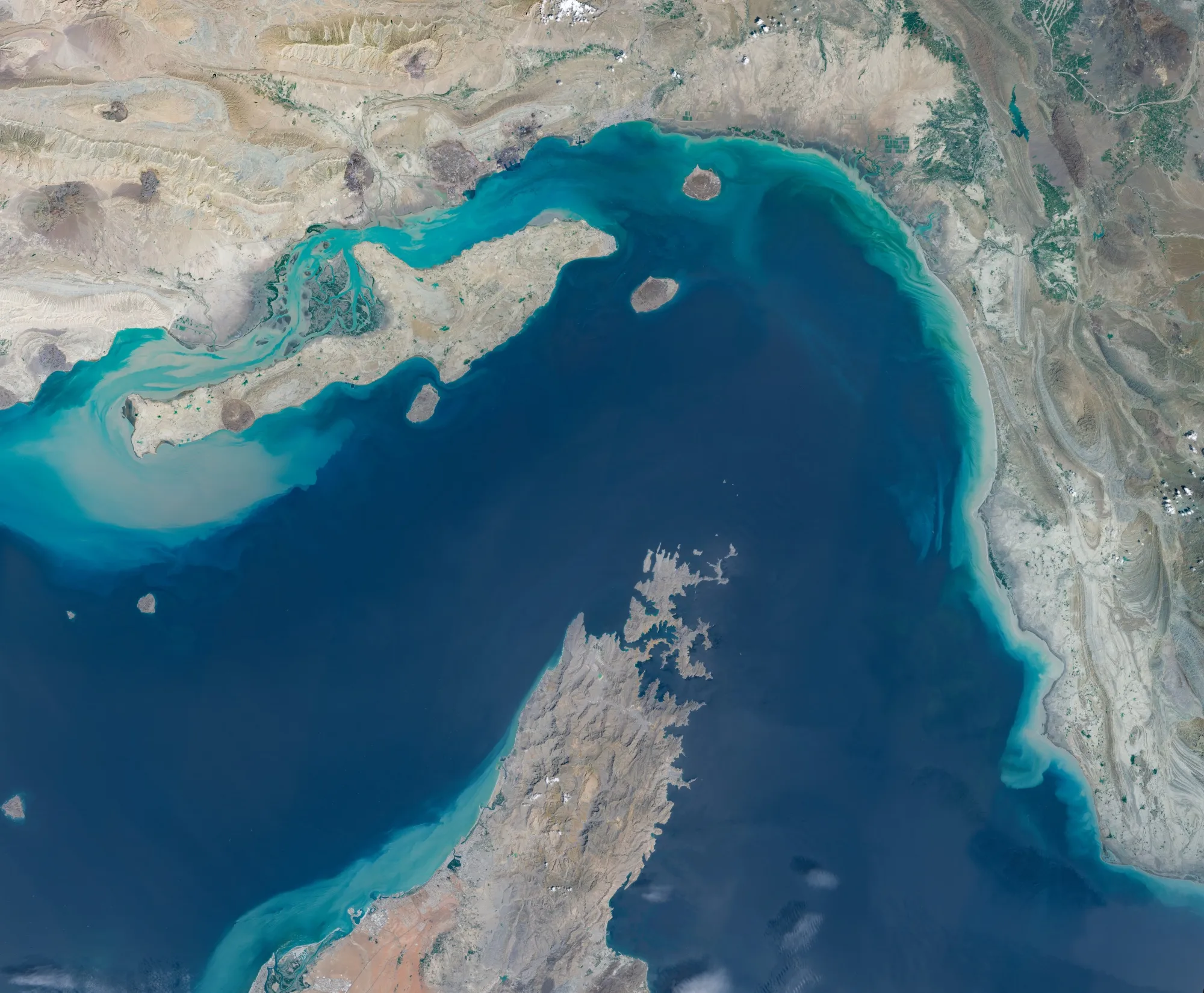 A satellite image of the Strait of Hormuz between southern Iran and Oman's Musandam Peninsula.