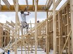 Construction workers frame a new home being built in Buda, Texas.