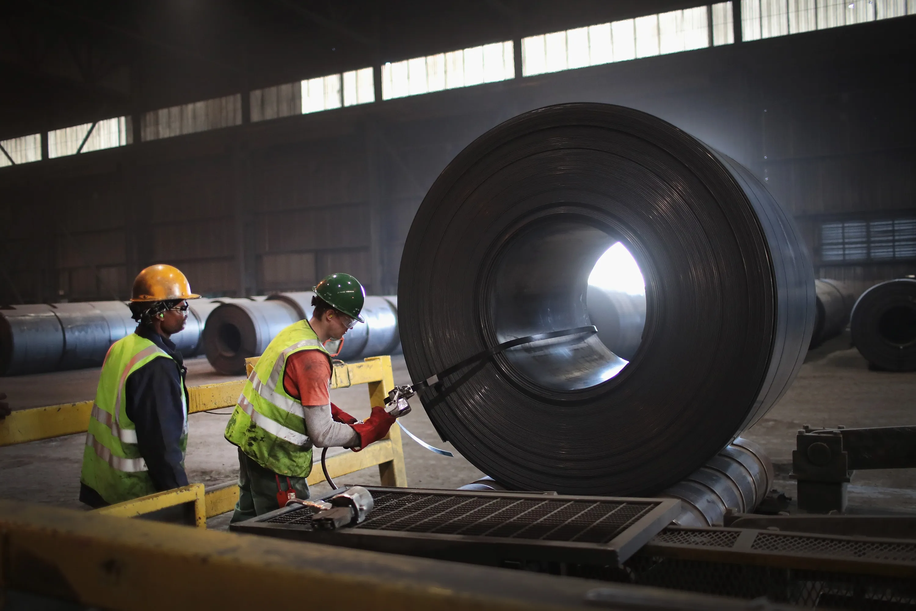 Workers band a steel coil during steel production at a&nbsp;steel mill in Portage, Indiana.&nbsp;