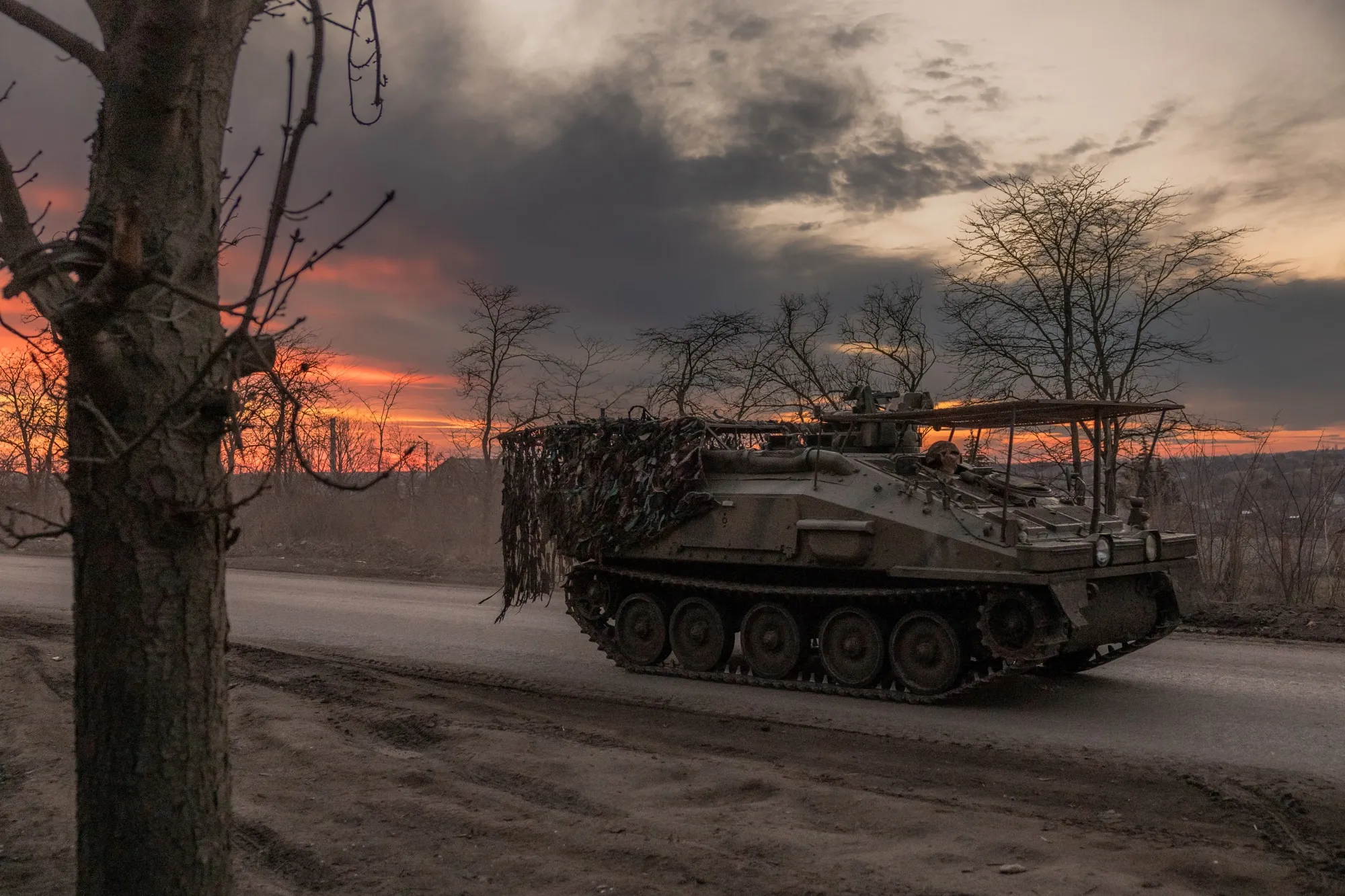 A Ukrainian serviceman drives an&nbsp;armoured personnel carrier in the Donetsk region.