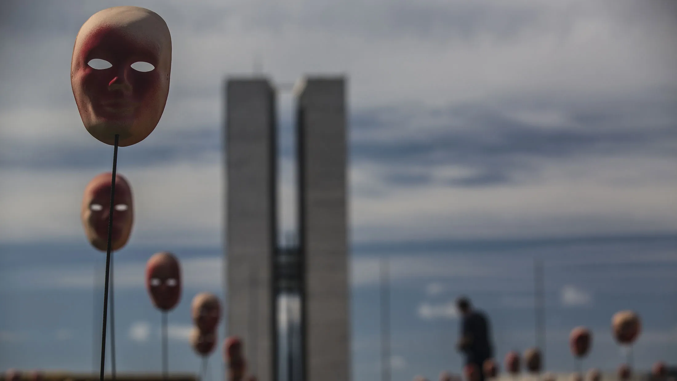 Red masks, part of the activist group Rio de Paz's art installation symbolizing Brazil's President Michel Temer and 594 Brazilian lawmakers, stand in Brasilia on May 23, 2017.
