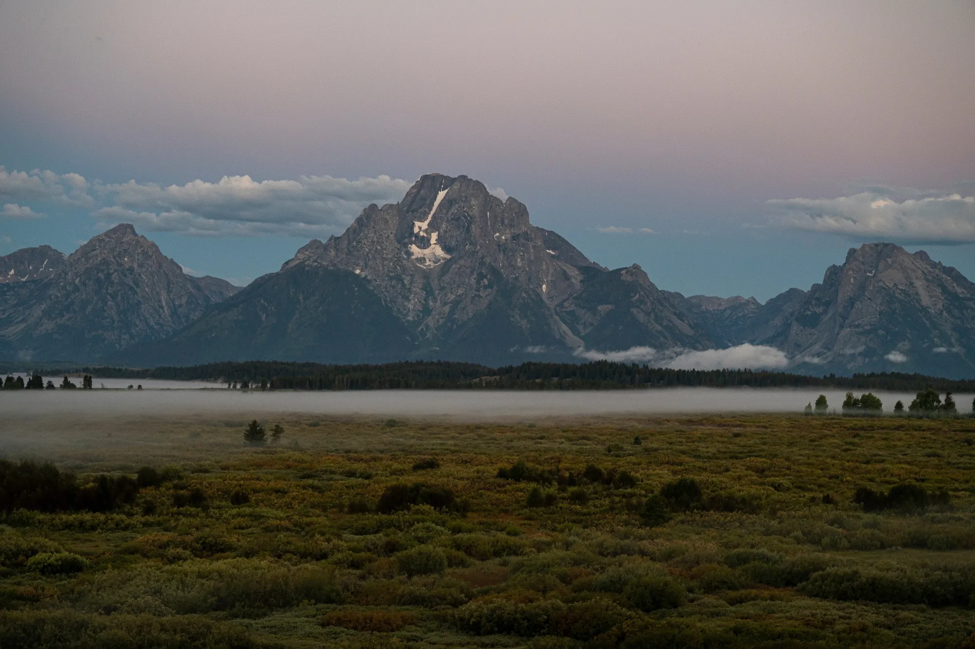 The Grand Tetons at sunrise at the Jackson Hole in Wyoming, home of an annual economic symposium.