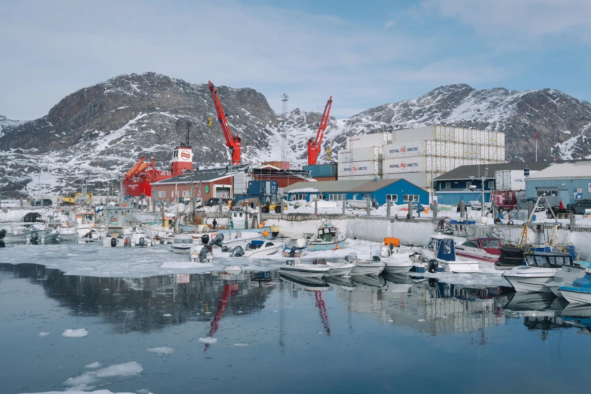 Fishing boats and small vessels at the port in Sisimiut, Greenland.