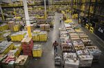Employees fill orders at the Amazon.com fulfillment center in Robbinsville, New Jersey.