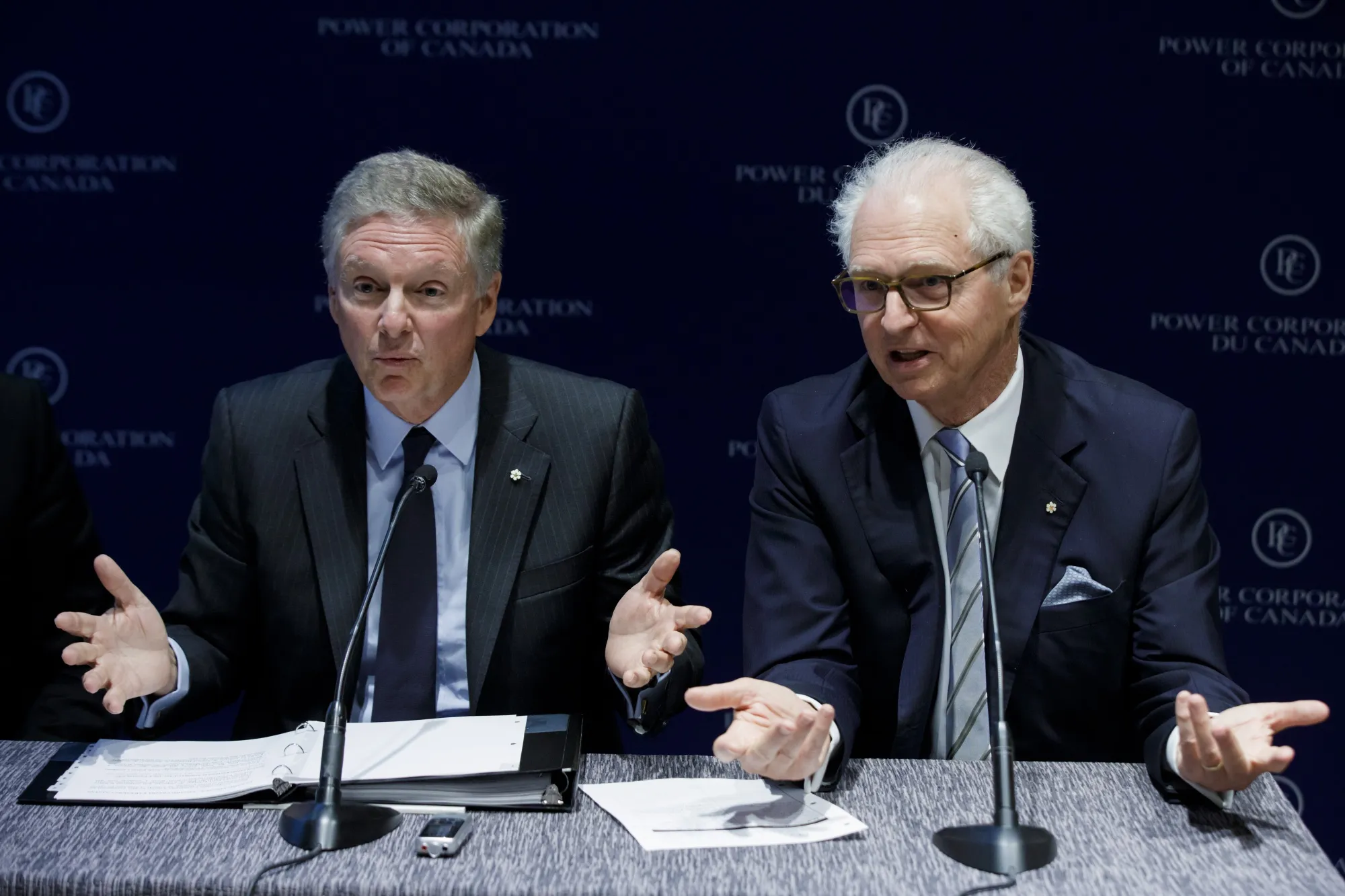 Paul Desmarais Jr. and Andre Desmarais speak after the Power Corp. of Canada annual general meeting in Toronto&nbsp;on May 14, 2019.