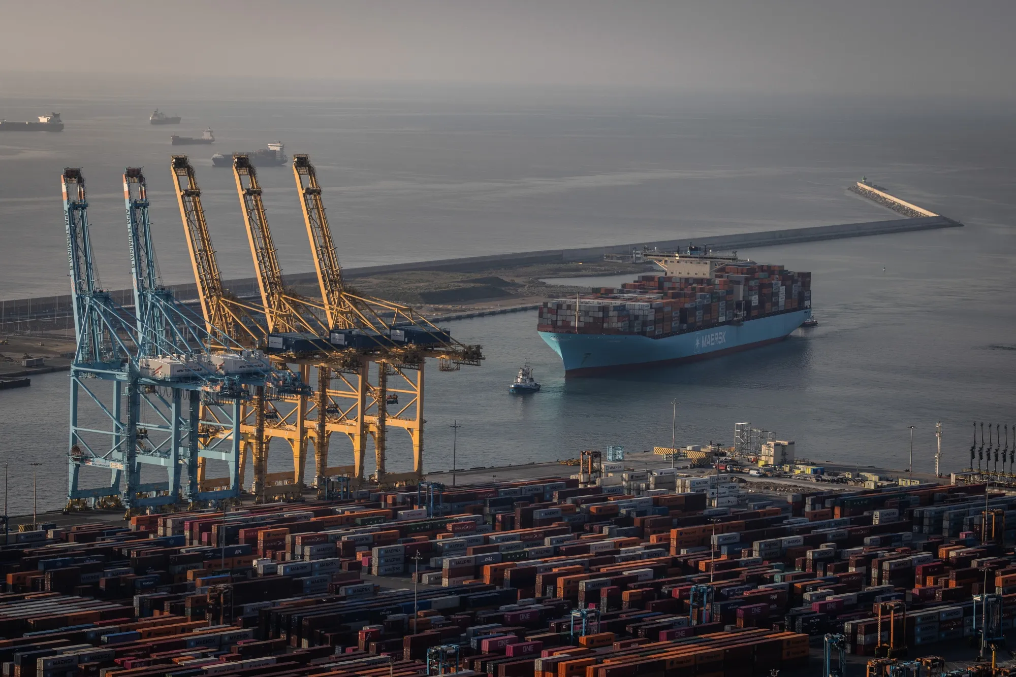 A cargo ship arrives in the port of Barcelona in Spain.