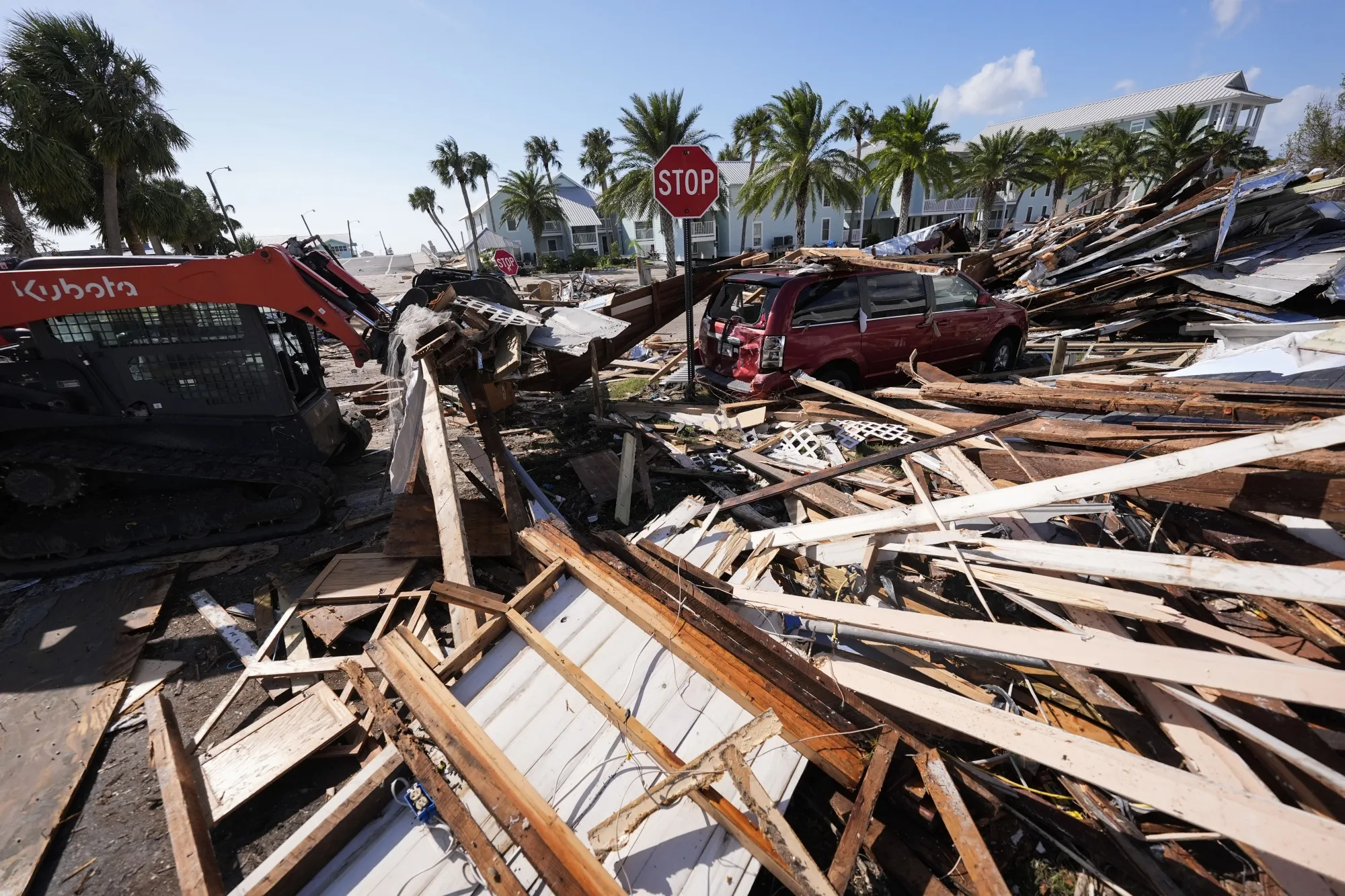 Workers clear debris in the aftermath of Hurricane Helene in Cedar Key, Florida, on Sept. 27.