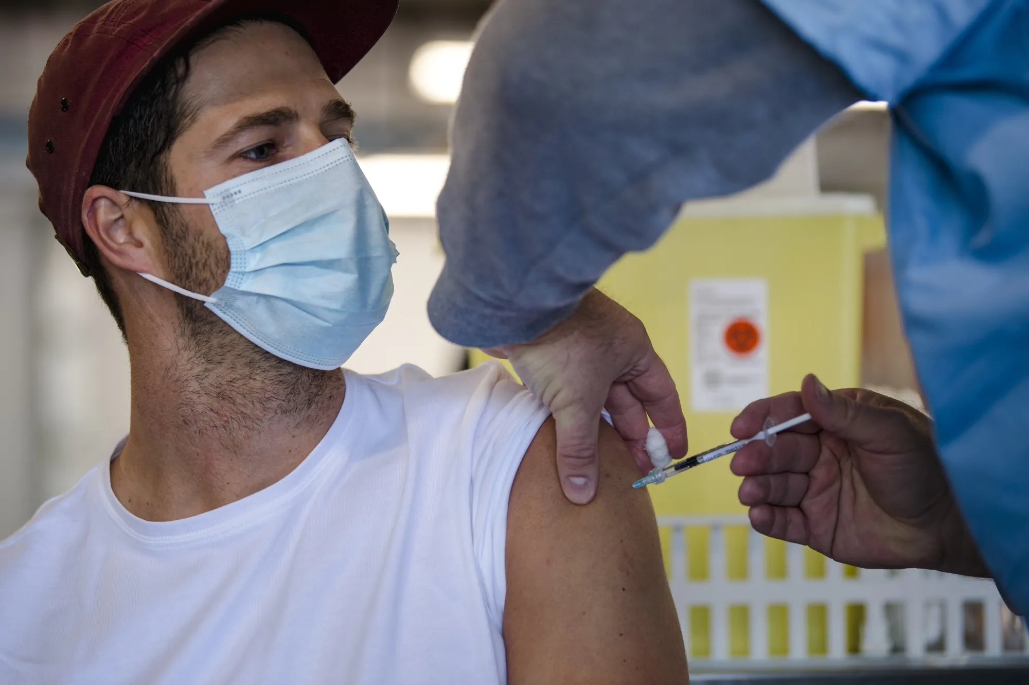 A cyclist receives a dose of the Pfizer-BioNTech Covid-19 vaccine at the Gilles Villeneuve racetrack in Montreal, Quebec, Canada, in May.