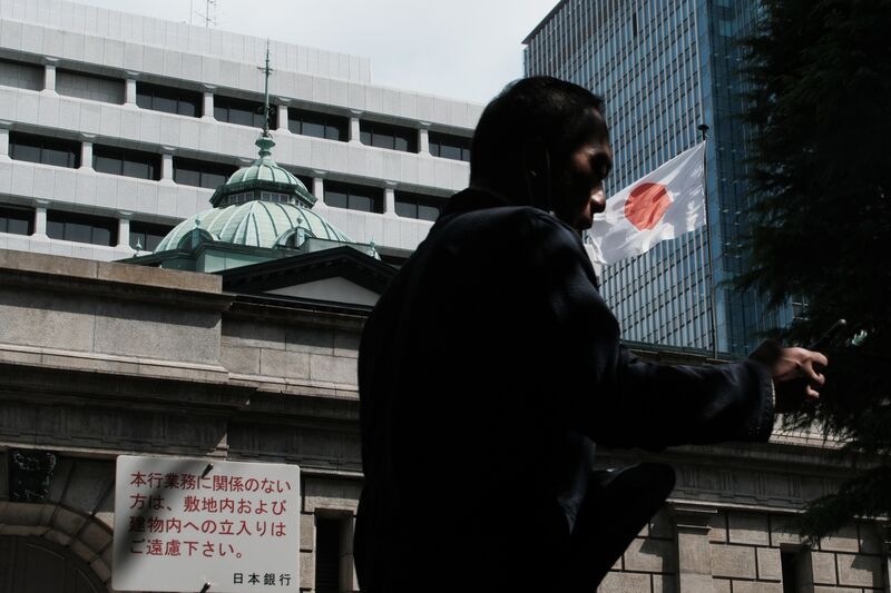 An pedestrian passing the Bank of Japan (BOJ) headquarters in Tokyo, Japan,