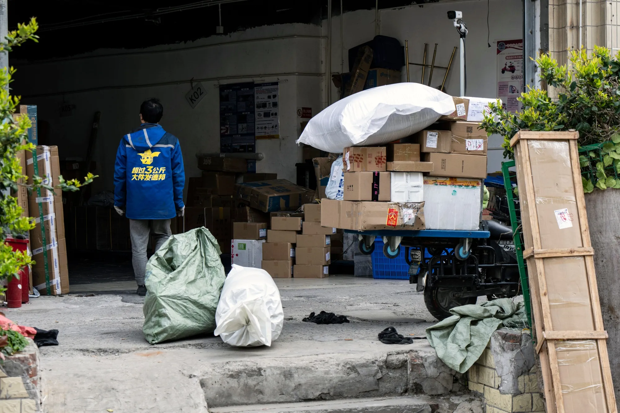 A delivery worker at a Deppon Logistics Co. sorting center in Shanghai, China.