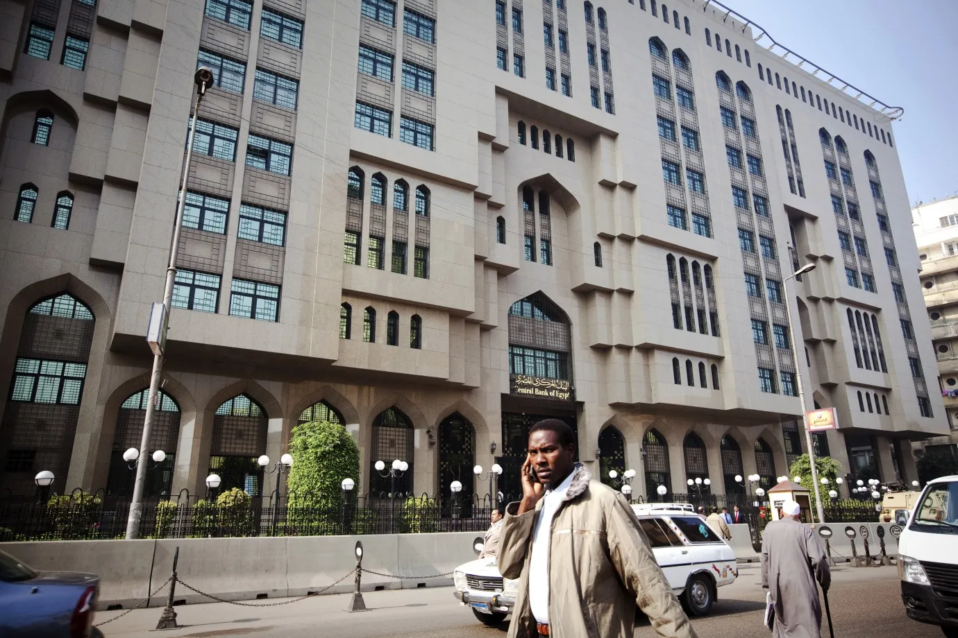 A pedestrian&nbsp;passes Egypt's central bank in Cairo, Egypt.