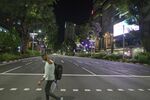 A pedestrian crosses Orchard Road during a partial lockdown imposed due to the coronavirus in Singapore.