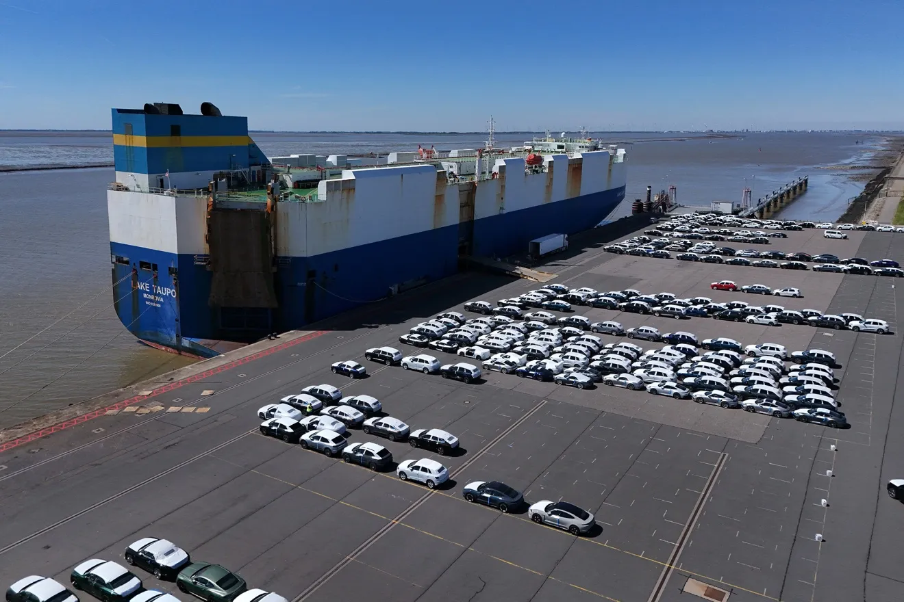A ship waits to load new cars&nbsp;in Emden, Germany.