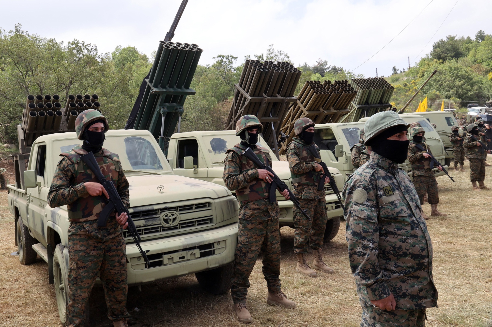 Hezbollah fighters near multiple rocket launchers in the village of Aaramta, southern Lebanon, in May.