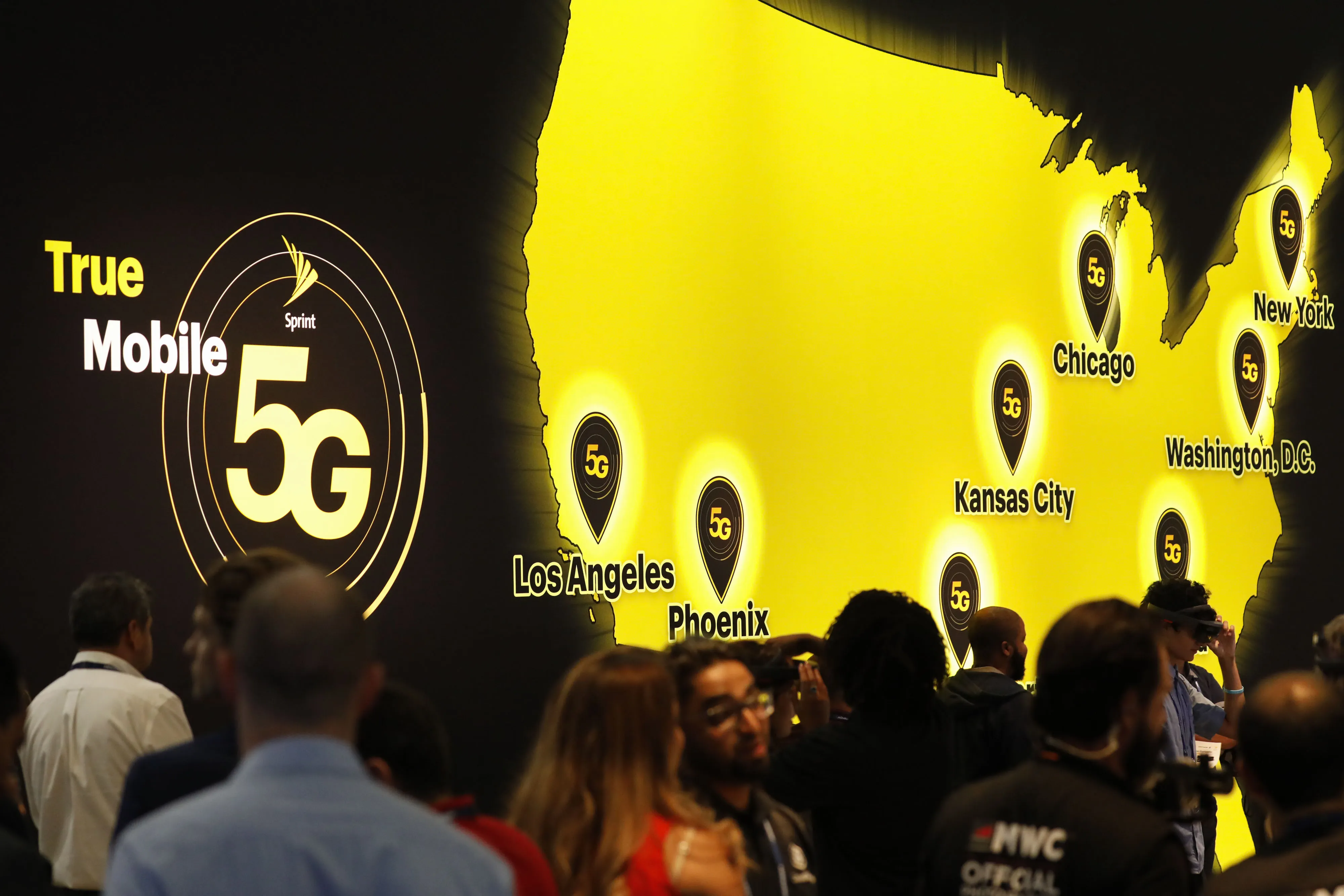 Attendees view a Sprint Corp. 5G wireless augmented reality headset demonstration at the company's booth during the Mobile World Congress Americas event in Los Angeles, California, on Oct. 22.