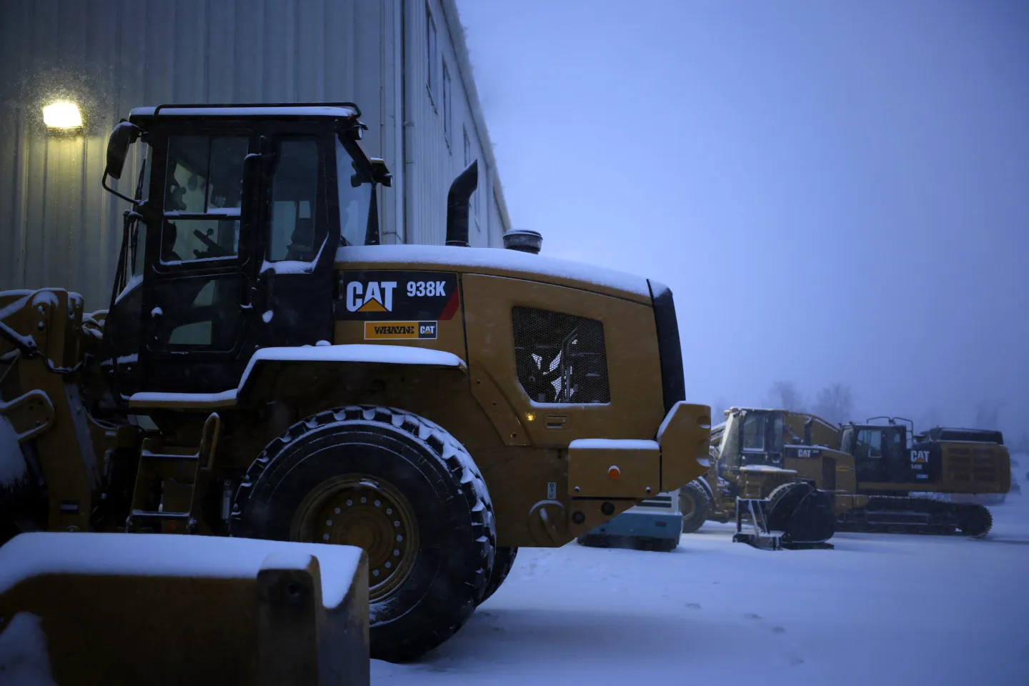 A Caterpillar 938K wheel loader sits in the snow at a supply company in Lexington, Kentucky.