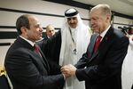 Recep Tayyip Erdogan, right, greets Abdel Fattah el-Sisi as they attend a reception at the opening ceremony of the 2022 FIFA World Cup in Qatar on Nov. 20.